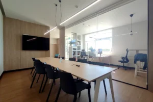 fully equipped meeting room in Lavra coworking space with glass partition and modern furnishings